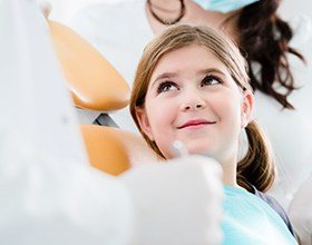 Young girl smiling in dental chair for children's dentistry visit