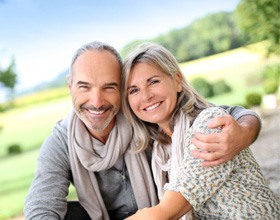 Happy couple enjoying benefits of All-on-4 in Chesterfield