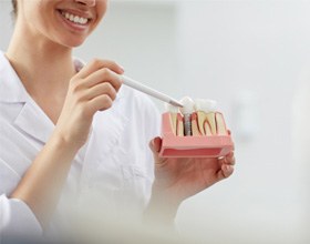 Dental professional explaining traditional implants vs All-on-4 in Chesterfield