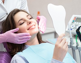 young woman smiling after getting cosmetic dentistry in Chesterfield