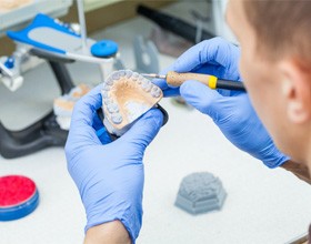 Lab technician making dentures