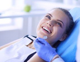 woman smiling in dental chair for dental bonding