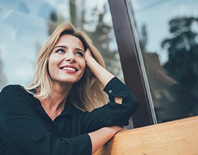 woman smiling about the cost of emergency dentistry in Chesterfield