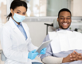 a patient smiling after undergoing dental treatment