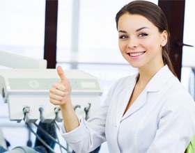 woman in dental chair giving thumbs up after I 3 D scan