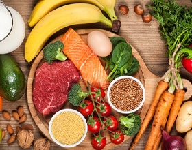 Variety of healthy foods on wooden table