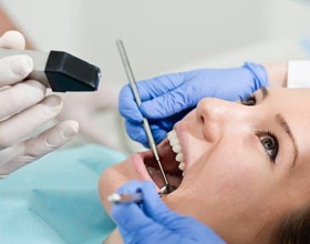 Woman receiving dental treatment guided by iTero digital impressions
