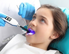 Child receiving dental sealants