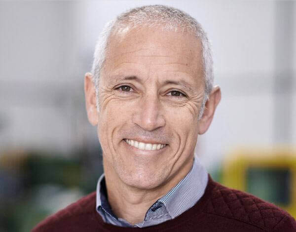 Smiling senior man wearing red sweater