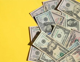 Cash on yellow background