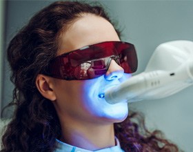 Woman having in-office teeth whitening