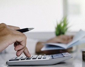 Man calculating cost of veneers in Chesterfield