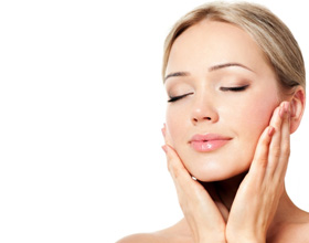 Woman gently touching her face, enjoying her beautiful skin