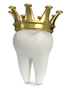 white tooth with gold crown 