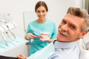 Smiling man getting dental implants in Chesterfield