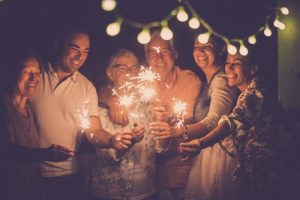 family smiling at New Year’s Eve celebration