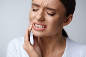 Woman experiencing dental discomfort