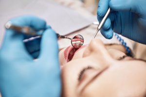 Facial close up of a woman having a dental exam