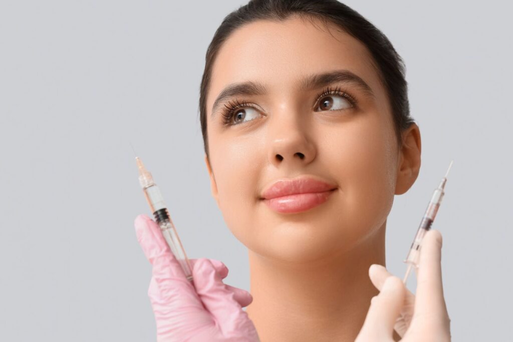 A woman looking at two wrinkle treatment needles.